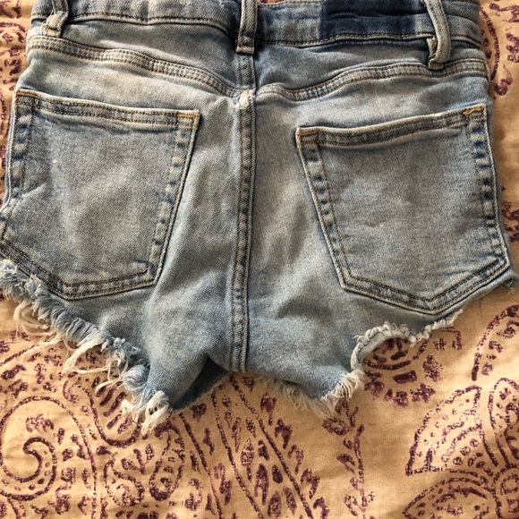 Light blue distressed jean shorts. - Picture 2 of 3